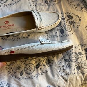 White pebbled leather slides